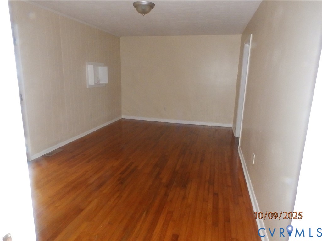 860 Lebanon Road Spring Grove, VA 23881 - Photo 10 of 32 an empty room with wooden floor and windows