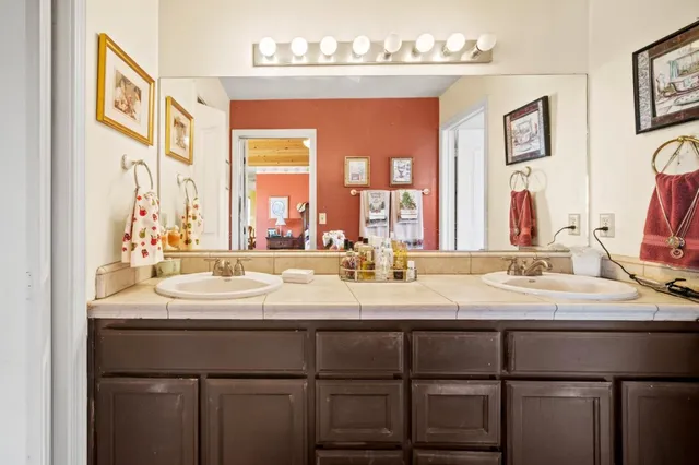 a bathroom with a sink and a mirror