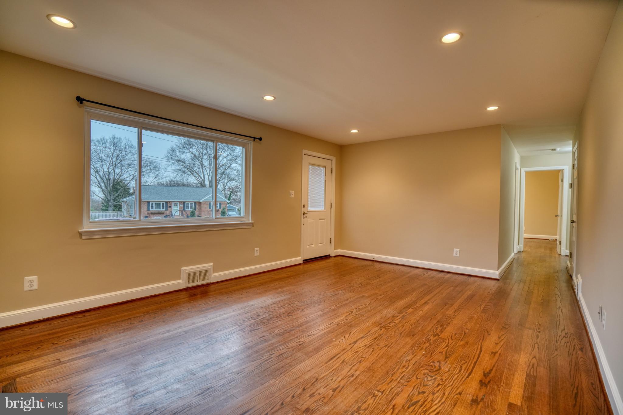 6000 Grayson Street Springfield, VA 22150 - Photo 12 of 37 a view of empty room with wooden floor and fan
