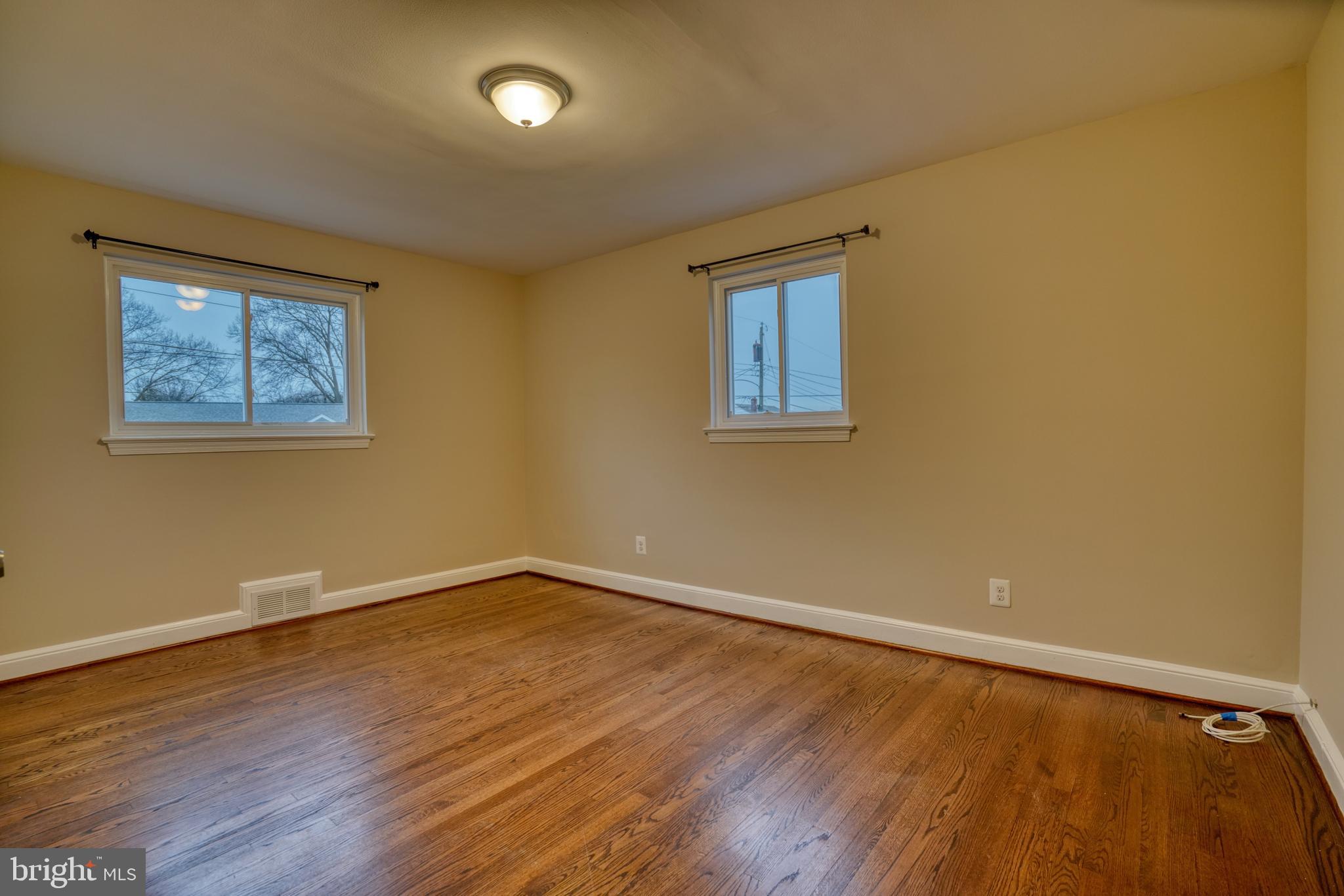6000 Grayson Street Springfield, VA 22150 - Photo 17 of 37 a view of an empty room with wooden floor and a window