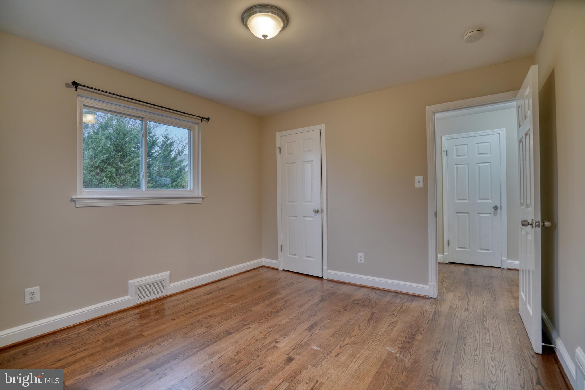 6000 Grayson Street Springfield, VA 22150 - Photo 18 of 37 a view of an empty room with wooden floor and a window