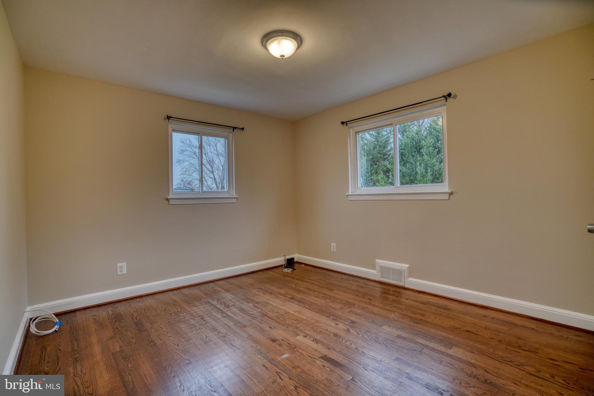 6000 Grayson Street Springfield, VA 22150 - Photo 19 of 37 a view of empty room with wooden floor and fan
