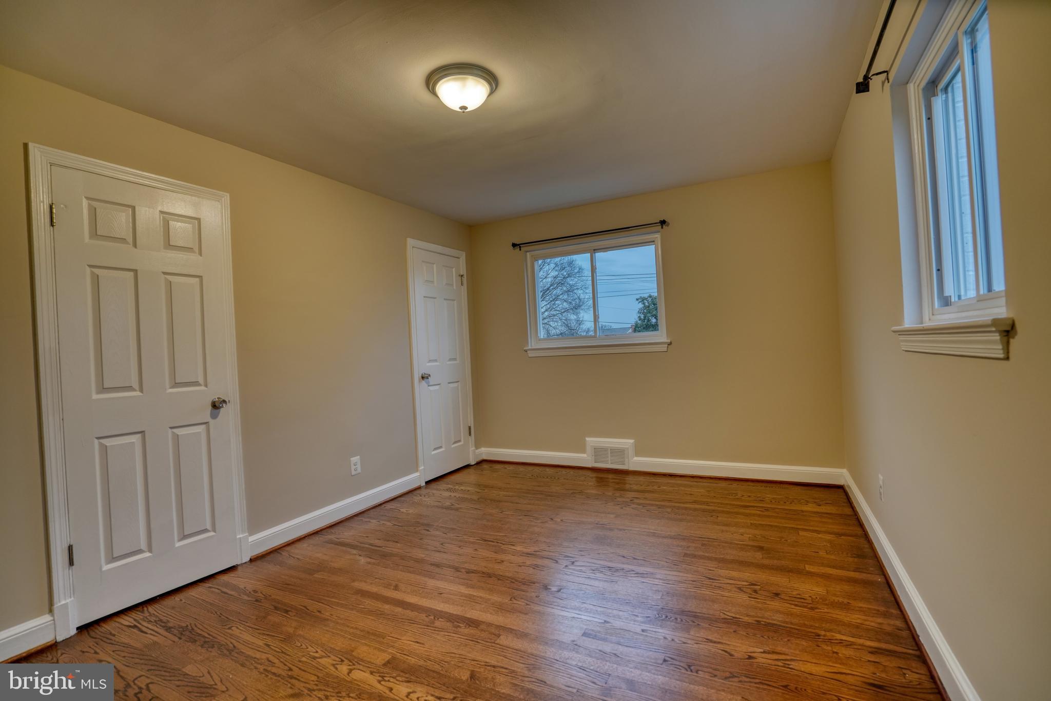 6000 Grayson Street Springfield, VA 22150 - Photo 22 of 37 a view of an empty room with wooden floor and a window
