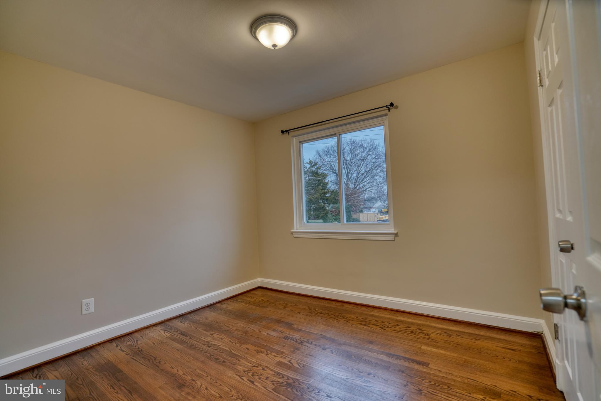 6000 Grayson Street Springfield, VA 22150 - Photo 24 of 37 an empty room with wooden floor and windows