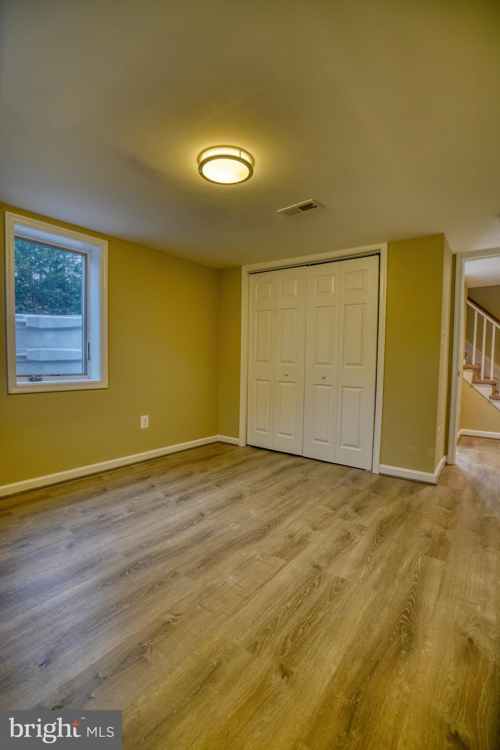 6000 Grayson Street Springfield, VA 22150 - Photo 26 of 37 an empty room with wooden floor and windows