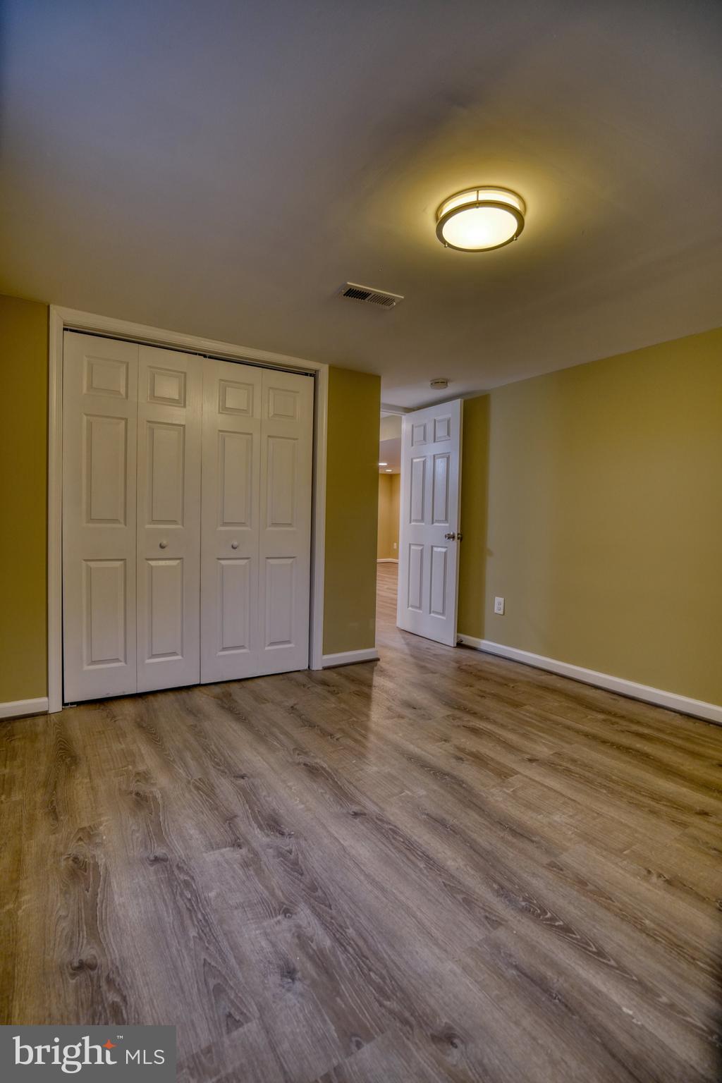 6000 Grayson Street Springfield, VA 22150 - Photo 28 of 37 a view of an empty room with wooden floor and a window