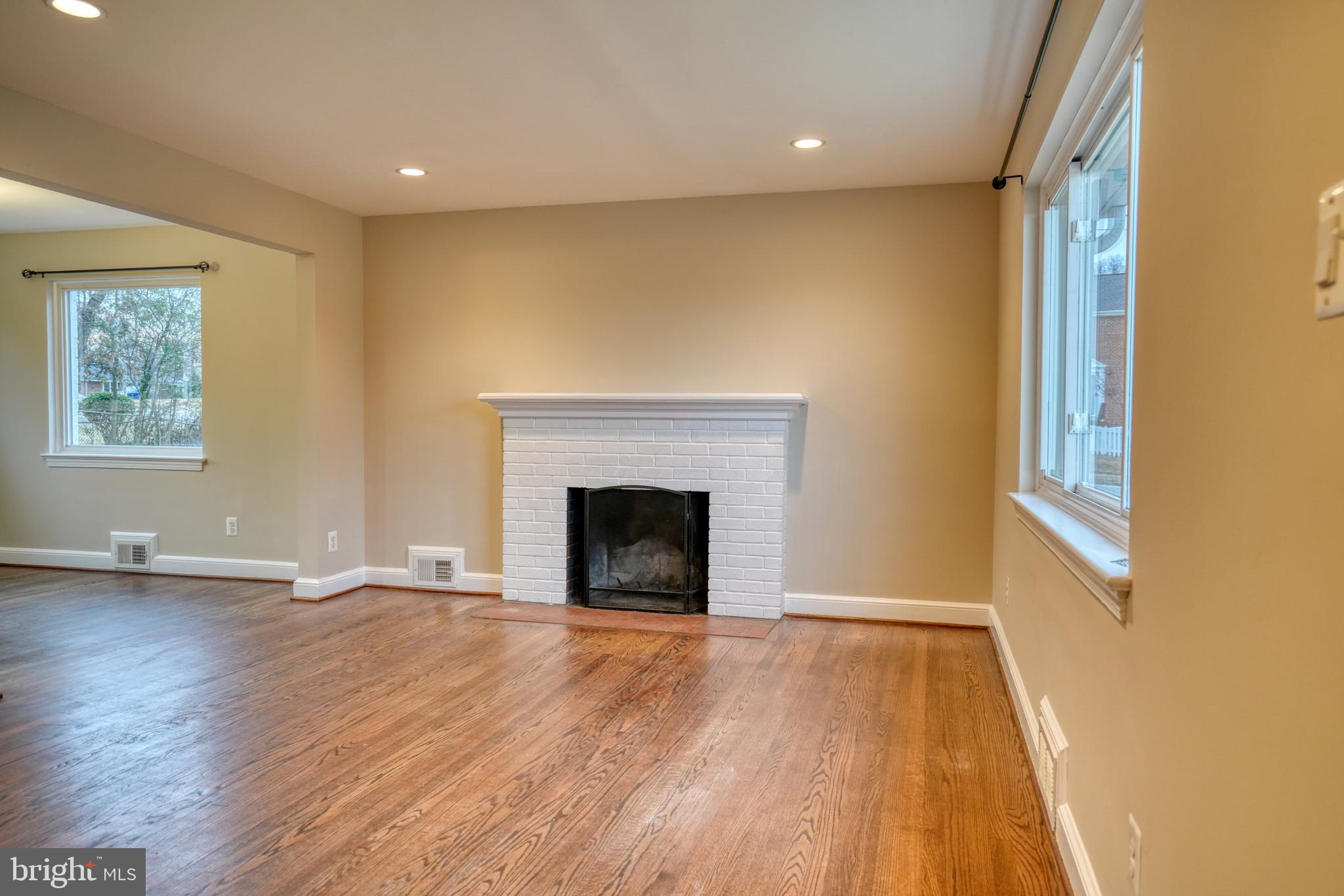 6000 Grayson Street Springfield, VA 22150 - Photo 4 of 37 a view of an empty room with wooden floor and a window