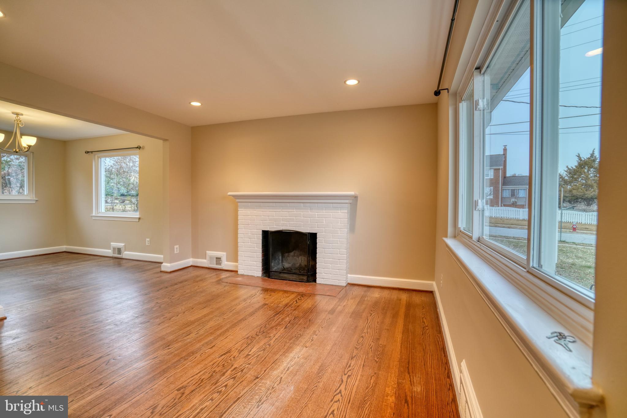 6000 Grayson Street Springfield, VA 22150 - Photo 5 of 37 a view of an empty room with wooden floor and a window