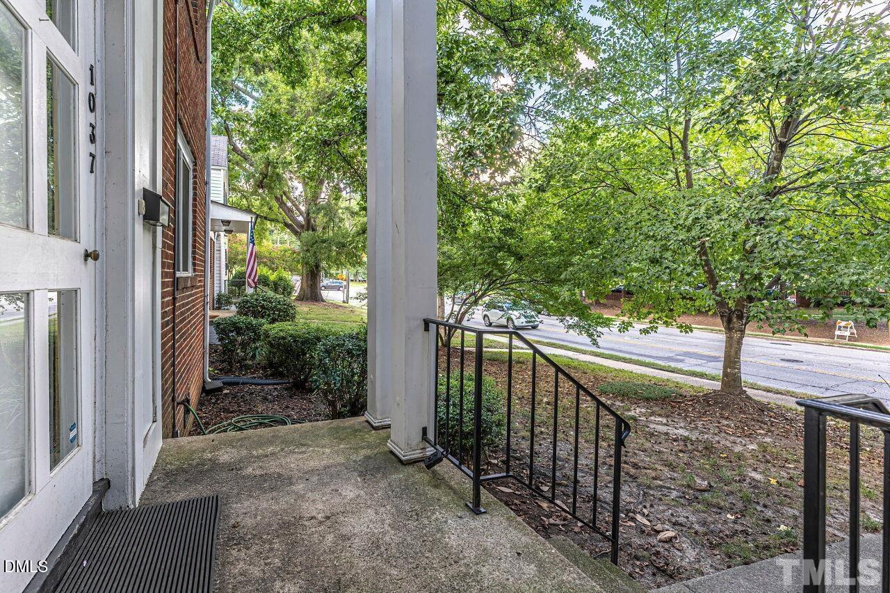 1037 St Marys Street, Unit 1037 Raleigh, NC 27605 - Photo 4 of 36 a view of a house with a tree in front