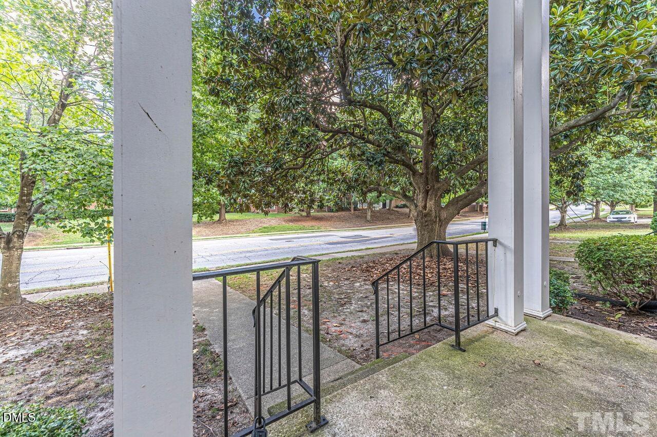 1037 St Marys Street, Unit 1037 Raleigh, NC 27605 - Photo 5 of 36 a view of a balcony with a tree