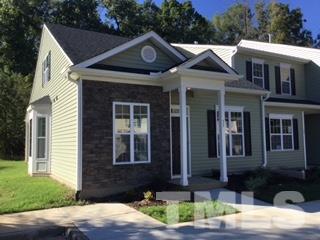 844 Horton Road, Unit 51 Durham, NC 27704 - Photo 1 of 13 a front view of a house with garden