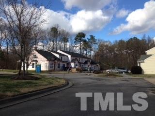 844 Horton Road, Unit 51 Durham, NC 27704 - Photo 12 of 13 a front view of a house with a yard