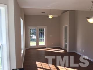 844 Horton Road, Unit 51 Durham, NC 27704 - Photo 3 of 13 a view of wooden floor and a window in a room