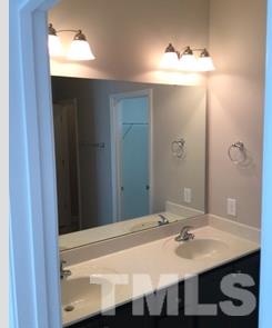 844 Horton Road, Unit 51 Durham, NC 27704 - Photo 8 of 13 a bathroom with a sink and a mirror