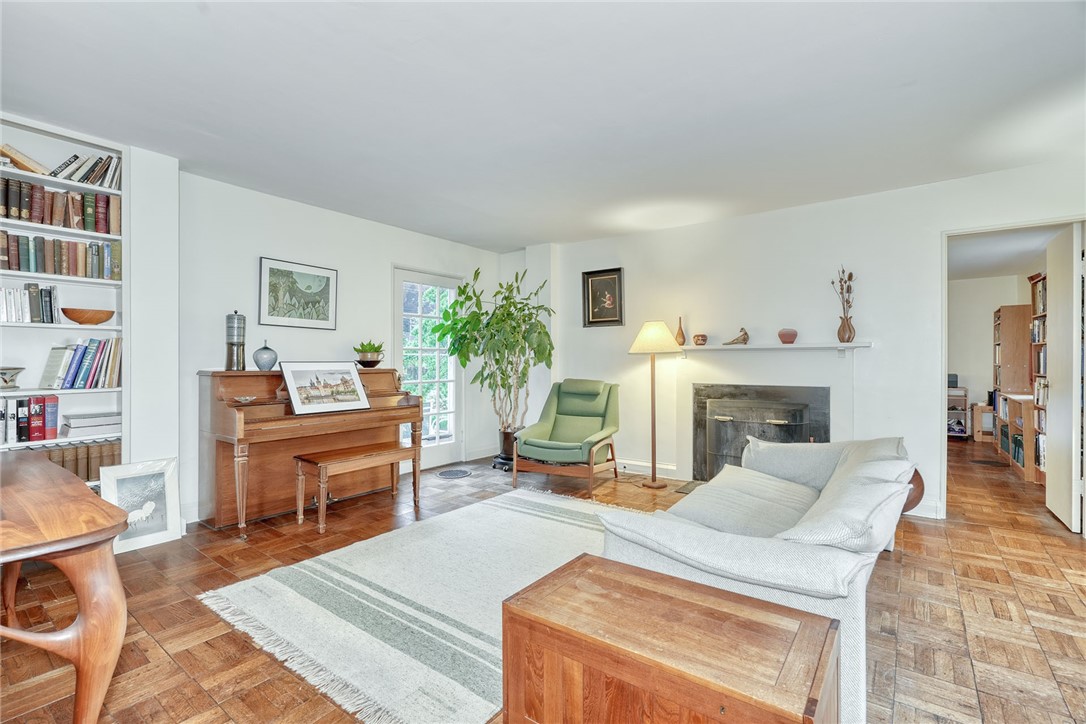 160 Commonwealth Road Brighton, NY 14618 - Photo 2 of 45 Living room with built-in bookcases and wood burni