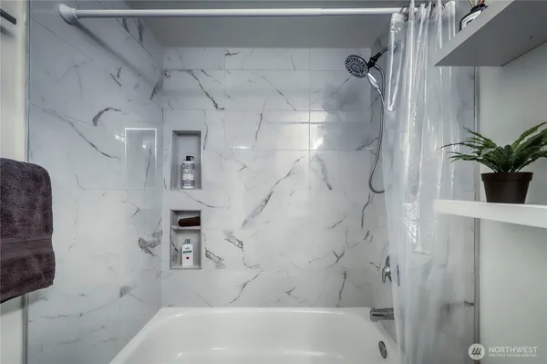 a bathroom with a sink toilet and mirror