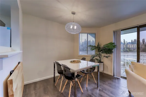 a view of a dining room with furniture window and wooden floor