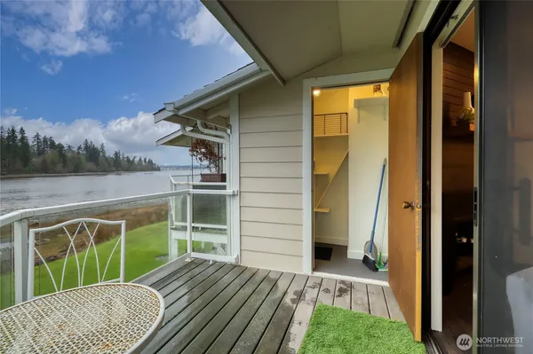 a view of balcony with wooden floor and fence