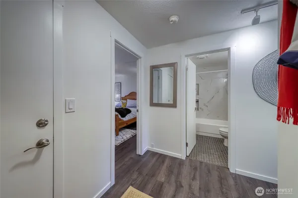 a bedroom with a bed and a lamp