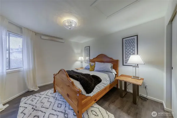 a bedroom with bed and window