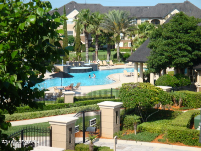 10961 Burnt Mill Road, Unit 138 Jacksonville, FL 32256 - Photo 1 of 3 a view of yard with outdoor seating and green space