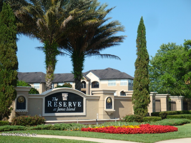 10961 Burnt Mill Road, Unit 138 Jacksonville, FL 32256 - Photo 2 of 3 a front view of a house with garden