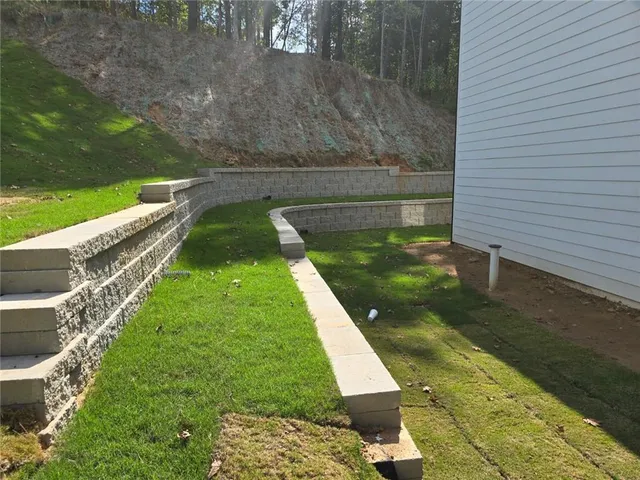 a view of a lake with a yard