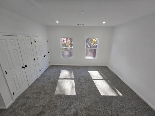 an entryway in a hall with a window