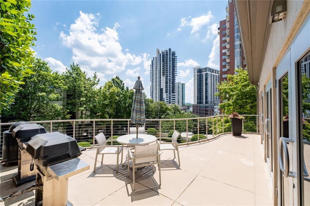 3475 Oak Valley Road Northeast, Unit 910 Atlanta, GA 30326 - Photo 26 of 27 a view of a terrace with furniture