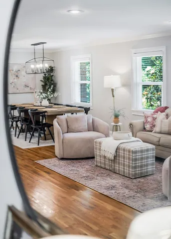 a vase of flowers sitting on a table with a glass door