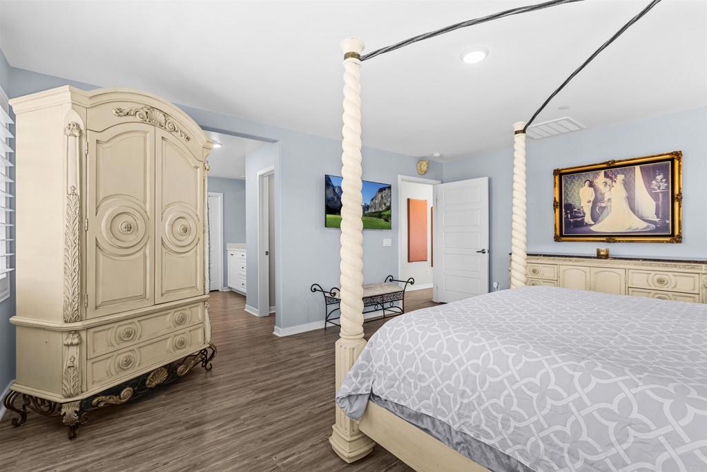 29809 Gypsy Vanner Way Menifee, CA 92584 - Photo 31 of 45 a bedroom with a bed dresser and a window