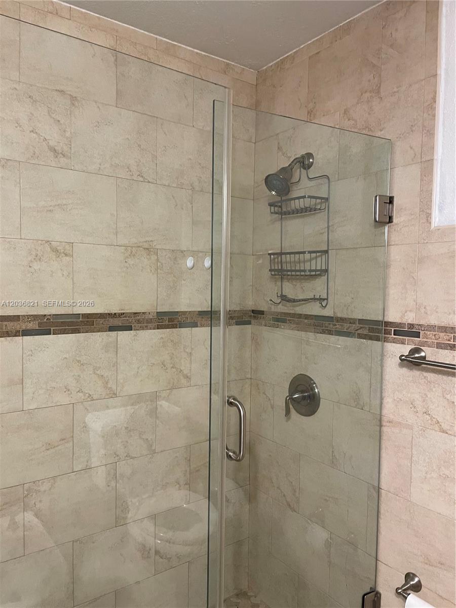 14770 Southwest 60th Street Miami, FL 33193 - Photo 10 of 16 a bathroom with a shower