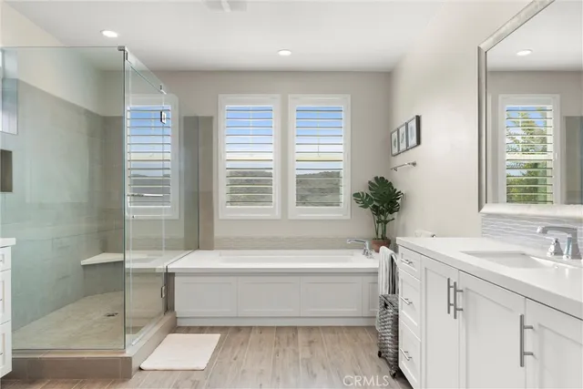 a bathroom with a bathtub and a sink