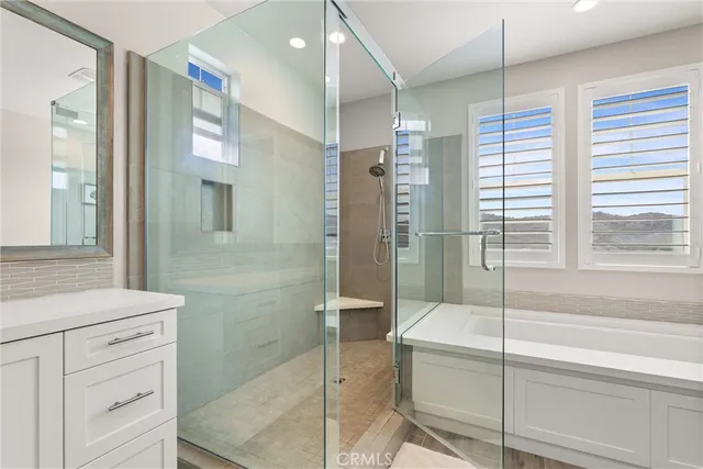 a bathroom with a bathtub and a shower