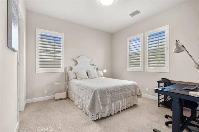 a bathroom with a sink vanity and a toilet