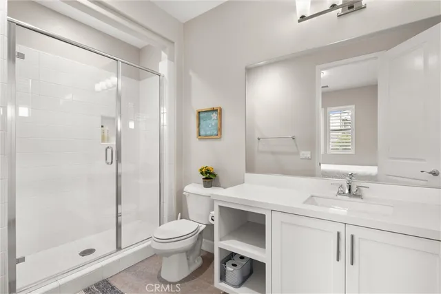 a kitchen with cabinets appliances a sink and a window