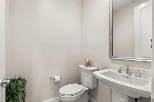 a view of living room with furniture and a fireplace
