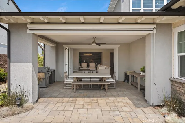 a view of a house with backyard and sitting area