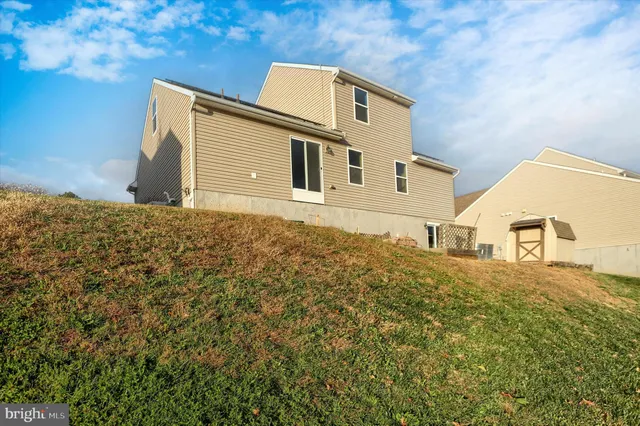 a view of a lake with houses in the back
