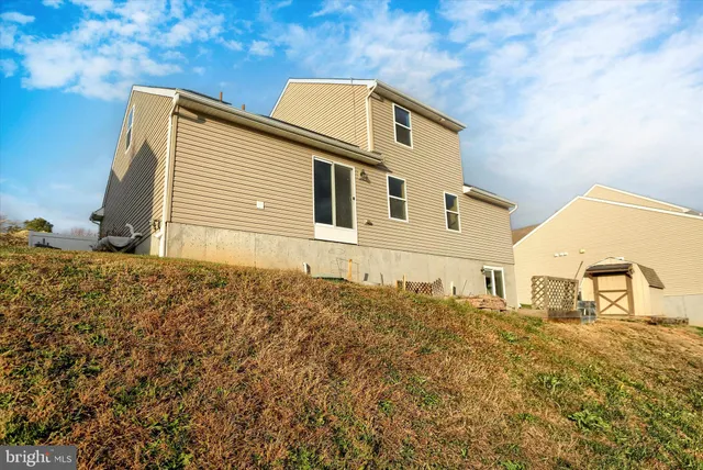 a view of a lake with houses in the back