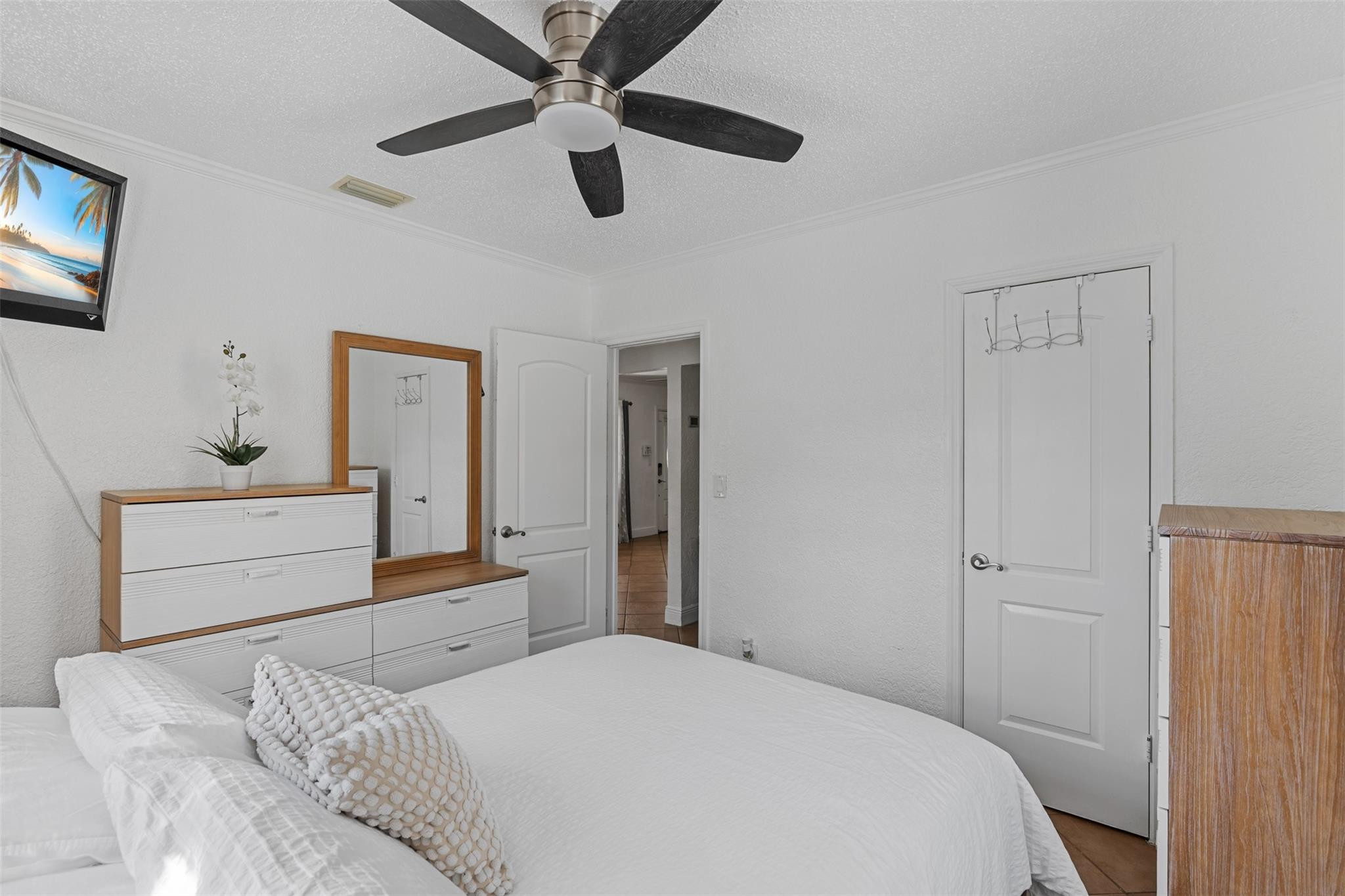 31 Miami Gardens Road West Park, FL 33023 - Photo 11 of 36 a bedroom with a bed and a dresser
