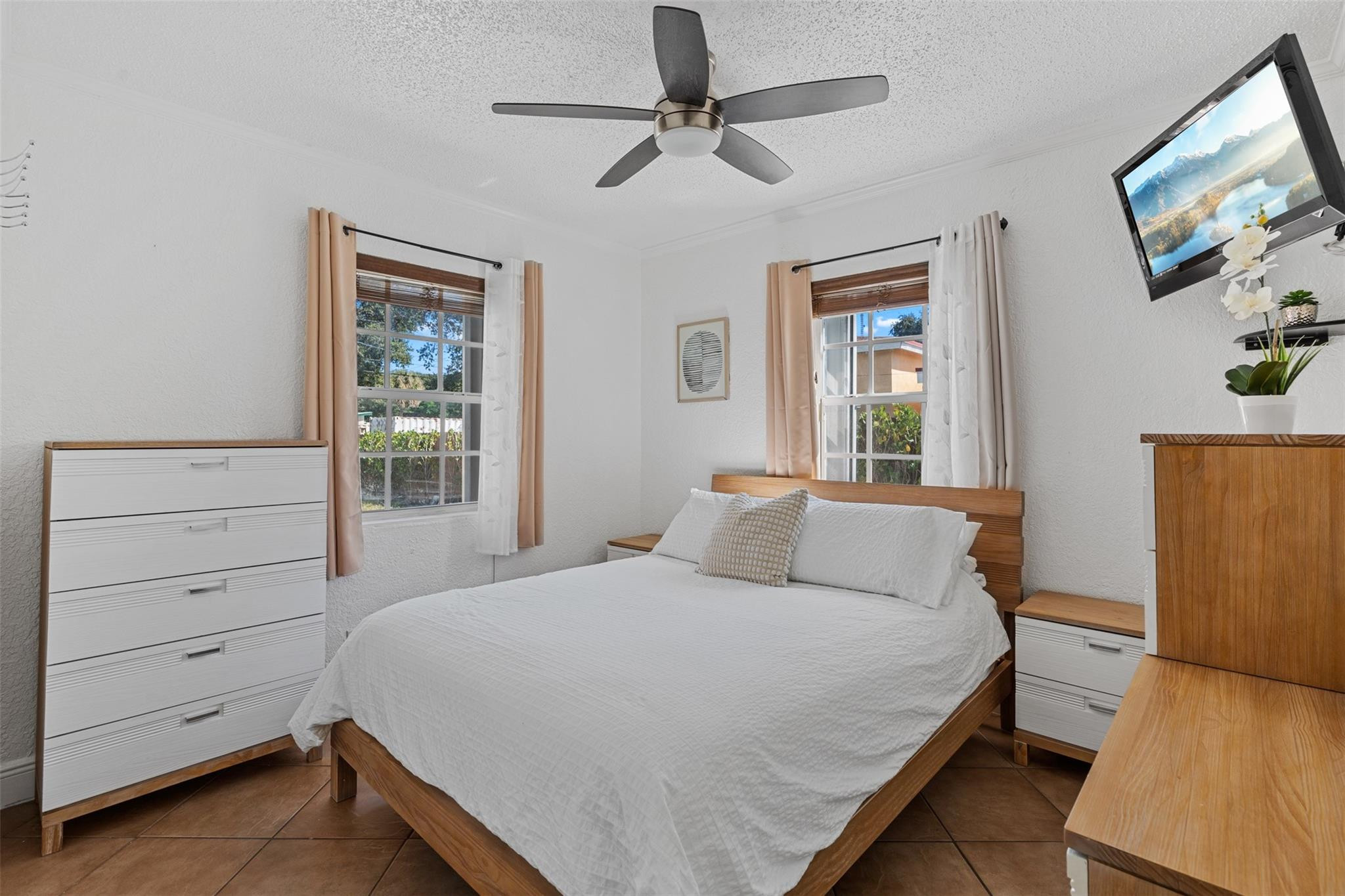 31 Miami Gardens Road West Park, FL 33023 - Photo 12 of 36 a bedroom with a bed and a window