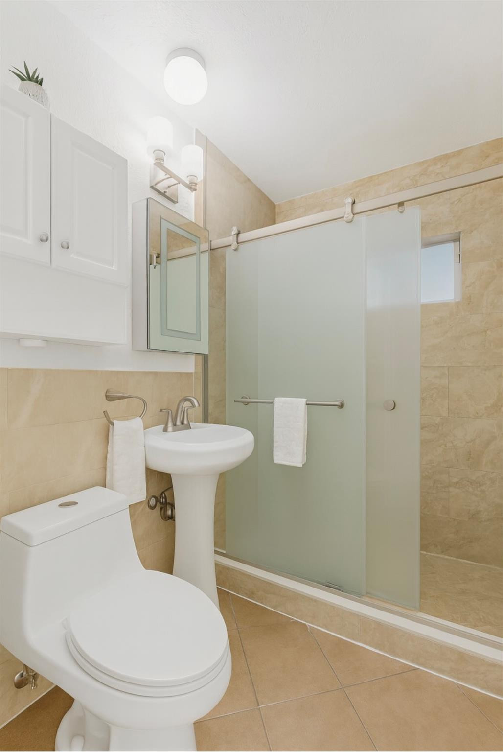 31 Miami Gardens Road West Park, FL 33023 - Photo 15 of 36 a bathroom with a sink a toilet and shower