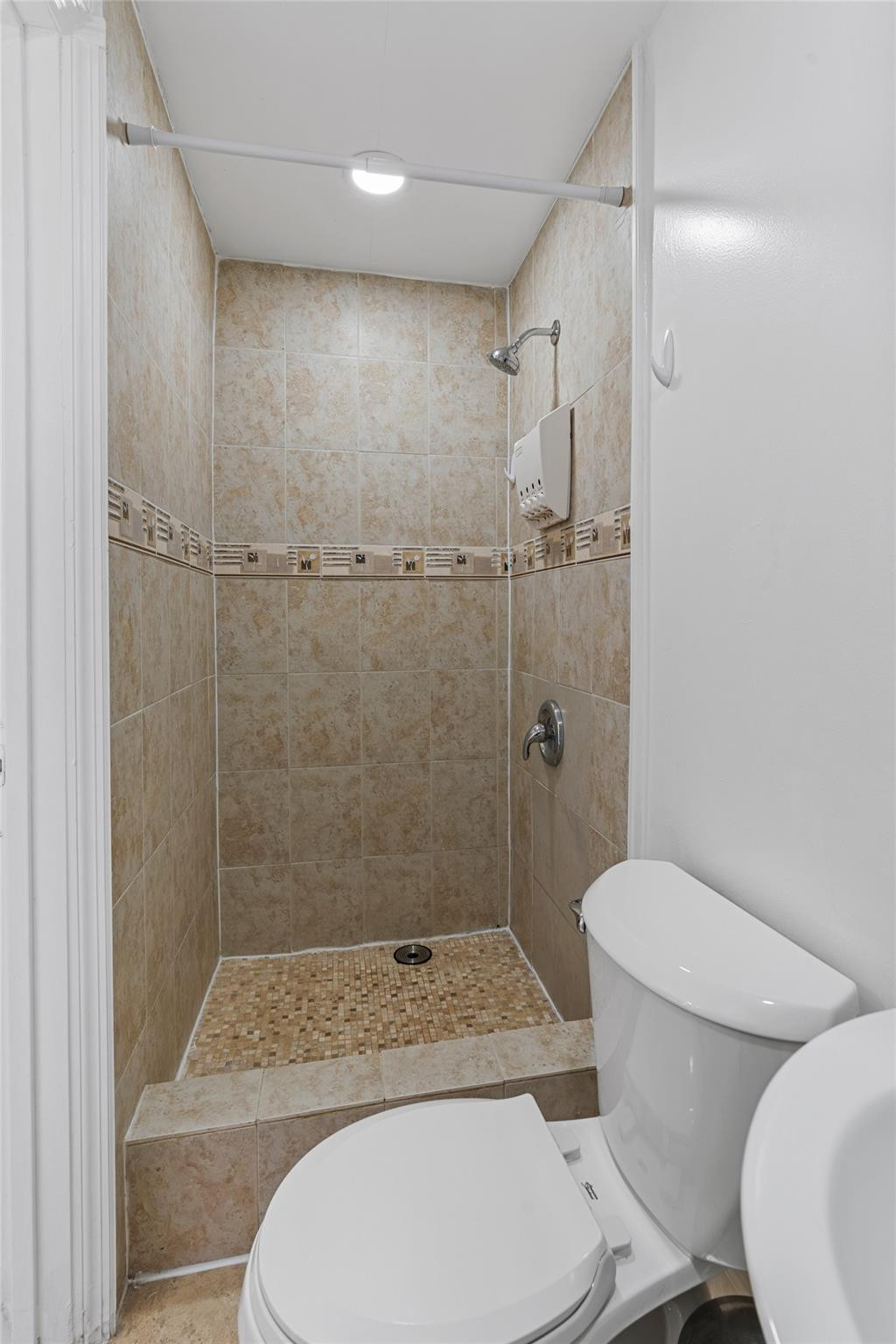 31 Miami Gardens Road West Park, FL 33023 - Photo 19 of 36 a bathroom with a toilet and a shower
