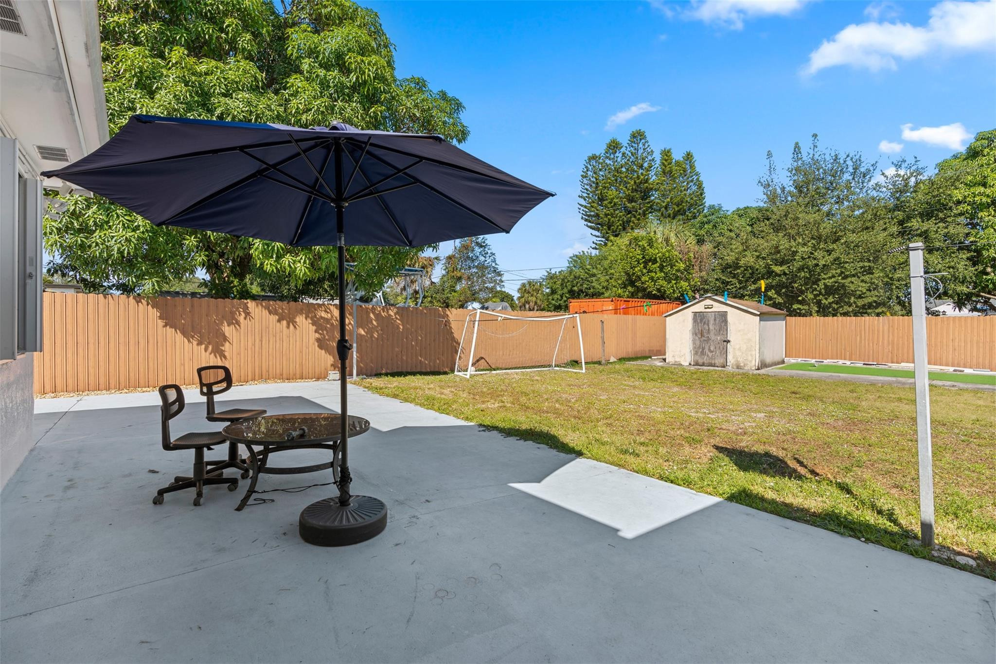 31 Miami Gardens Road West Park, FL 33023 - Photo 26 of 36 a view of a swimming pool with a lounge chair