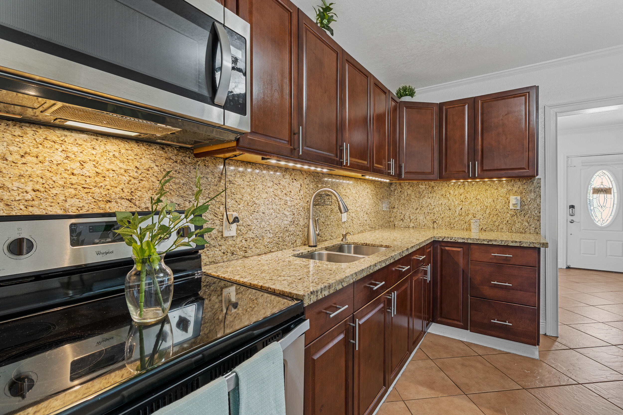31 Miami Gardens Road West Park, FL 33023 - Photo 7 of 36 a kitchen with a sink and cabinets