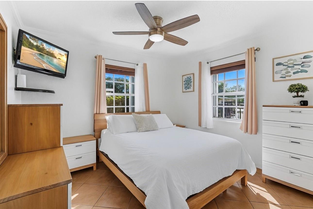 31 Miami Gardens Road West Park, FL 33023 - Photo 10 of 36 a bedroom with a bed and a window