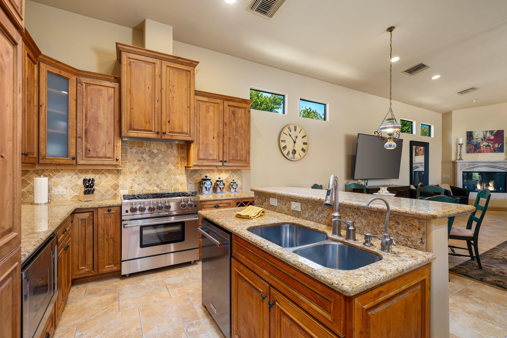42590 Sandy Bay Road Bermuda Dunes, CA 92203 - Photo 16 of 45 a kitchen with stainless steel appliances granite countertop a sink stove and refrigerator