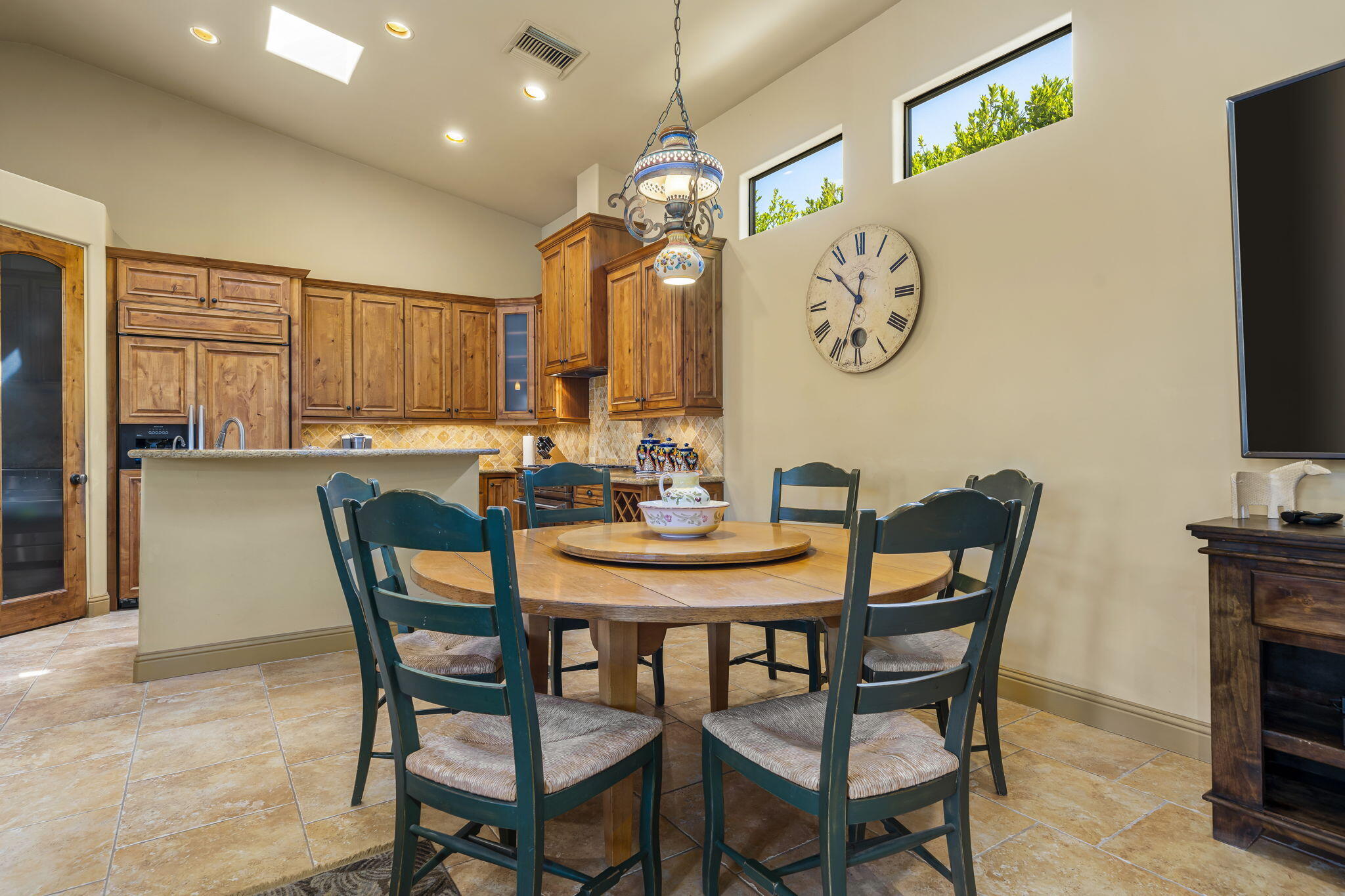 42590 Sandy Bay Road Bermuda Dunes, CA 92203 - Photo 17 of 45 a view of a dining room with furniture and a chandelier