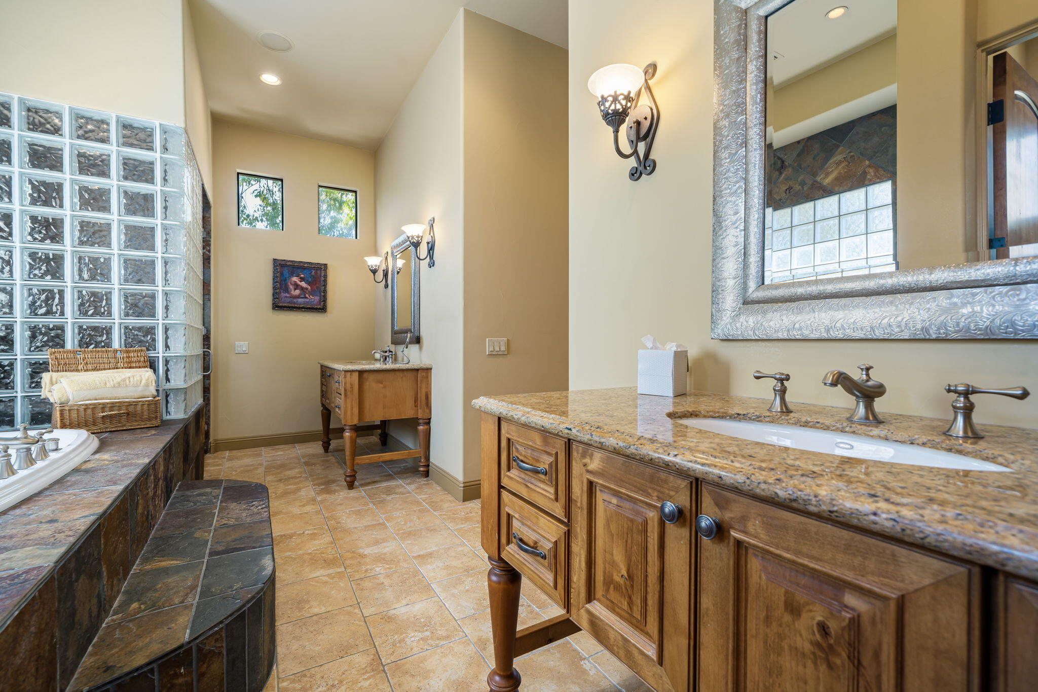42590 Sandy Bay Road Bermuda Dunes, CA 92203 - Photo 30 of 45 a spacious bathroom with a granite countertop sink a mirror and a shower